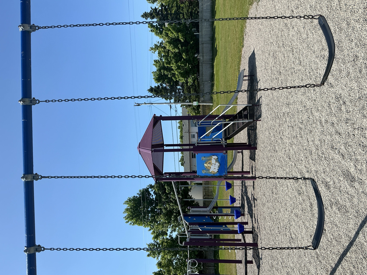 swings and play structure at the park